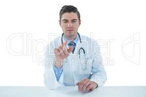 Doctor using a digital tablet against white background