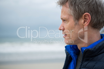 Close-up of thoughtful man on beach