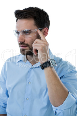 Man wearing protective eyewear and smart watch