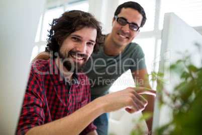 Graphic designers working at desk