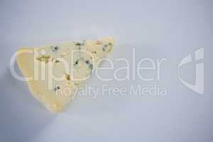 Piece of cheese on white background