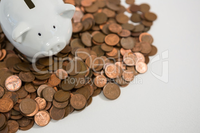 Piggy bank with stack of coins