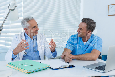 Surgeon and doctor interacting with each other