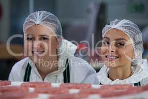 Female butchers at meat factory
