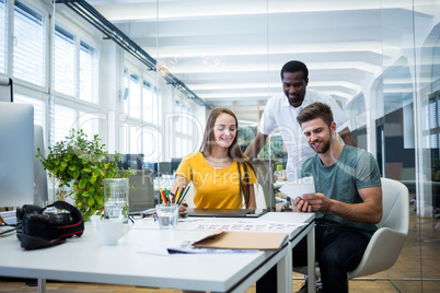 Graphic designers working at desk