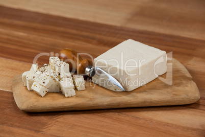 Slices of cheese with knife