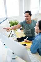 Graphic designers working over computer