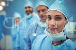 Portrait of female surgeon standing in operation theater