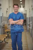 Portrait of male surgeon standing in corridor
