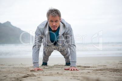 Man push-up on beach