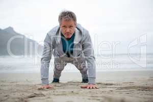 Man push-up on beach