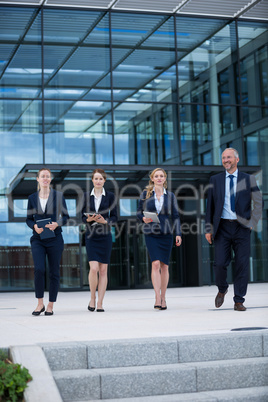 Businesspeople walking in office premises