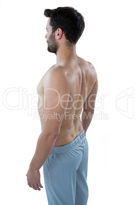 Shirtless man standing