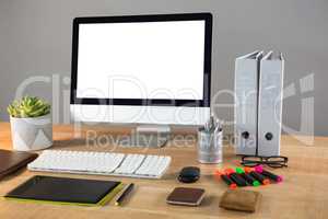 Desktop pc with office stationery