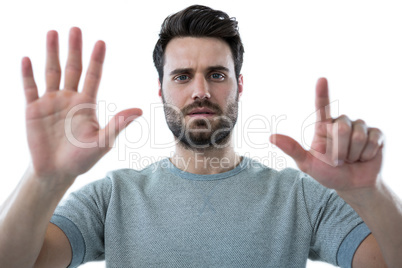 Man pretending to touch an invisible screen