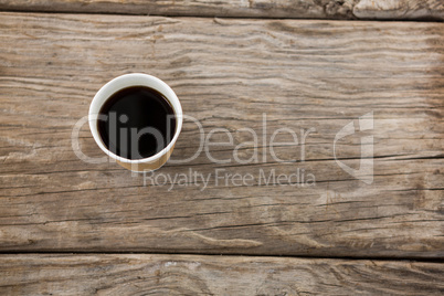 Cup of coffee on wooden table