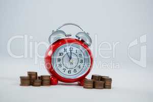 Alarm clock with stack of coins