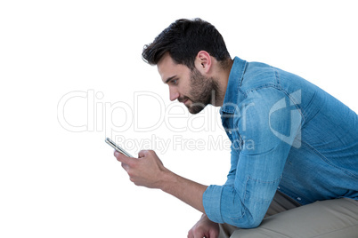 Man sitting and using mobile phone