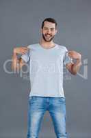 Cheerful man posing in grey t-shirt