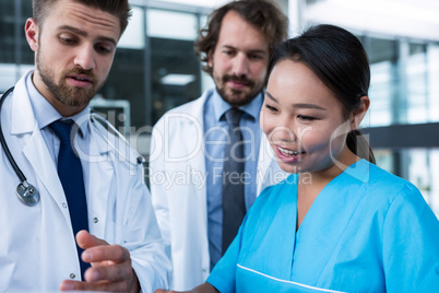 Doctors and nurse having a discussion