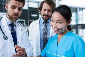 Doctors and nurse having a discussion