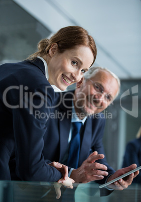 Businessman with colleague using digital tablet