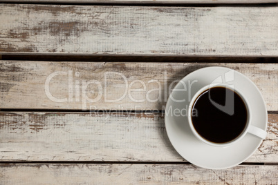 Cup of coffee on wooden table