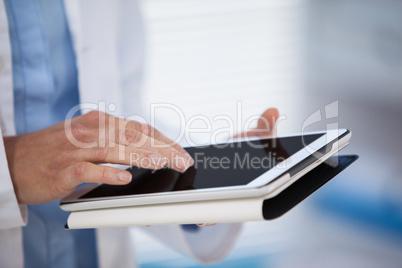 Doctor using digital tablet