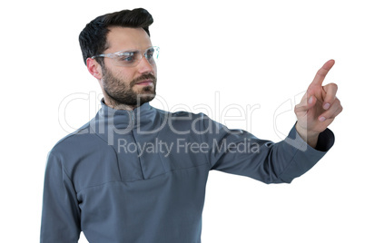 Man wearing protective eyewear pretending to touch an invisible object