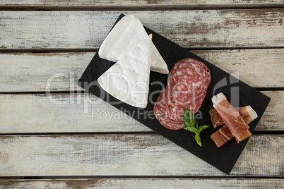 Brie cheese, salami, basil and sliced meat