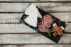 Brie cheese, salami, basil and sliced meat