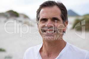 Portrait of smiling man on beach