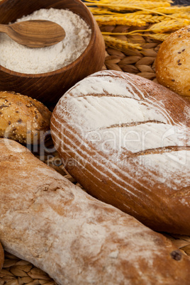 Various bread loaves with flour