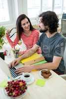 Graphic designers working at desk