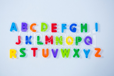 Multicolored alphabets on white background