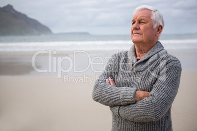 Thoughtful senior man standing