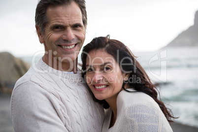 Couple embracing each other on beach