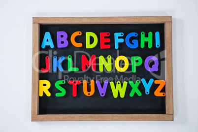 Multicolored alphabets on slate