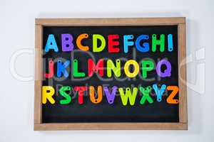 Multicolored alphabets on slate