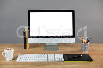 Desktop pc with cup of coffee