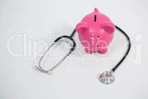 Piggy bank and stethoscope