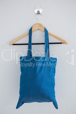 Blue bag hanging on hanger