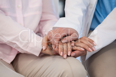 Close-up of female doctor consoling a patient