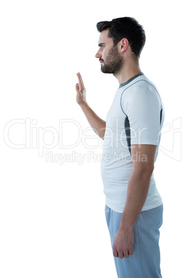 Man pretending to touch an invisible screen