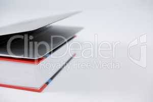 Close-up of laptop and book