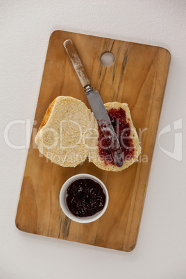 Bread with jam and knife