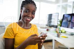 Female business executive with arms outstretched