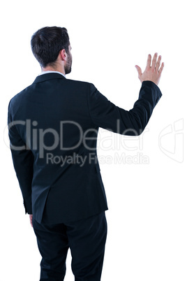Businessman pretending to touch an invisible screen