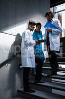 Doctors and nurse looking at digital tablet