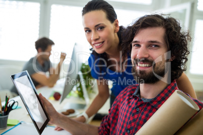 Business executives using digital tablet